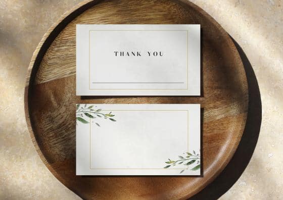 place cards on top of wooden plate